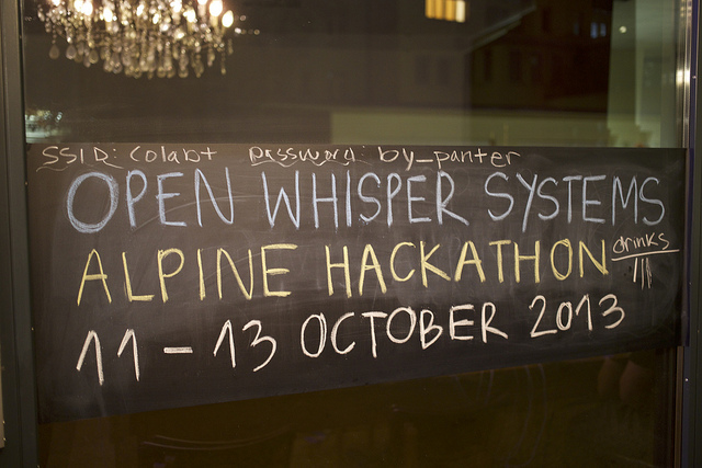 A sign reads: Open Whisper Systems Alphine Hackathon 11-13 October 2013